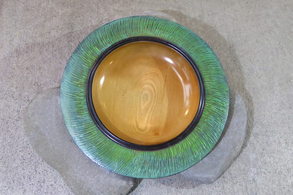 Bowl carved from NZ rimu with green edge by Hugh Mill