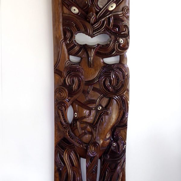 Carved wooden Poupou (part of a maori house) by Hohepa Peni