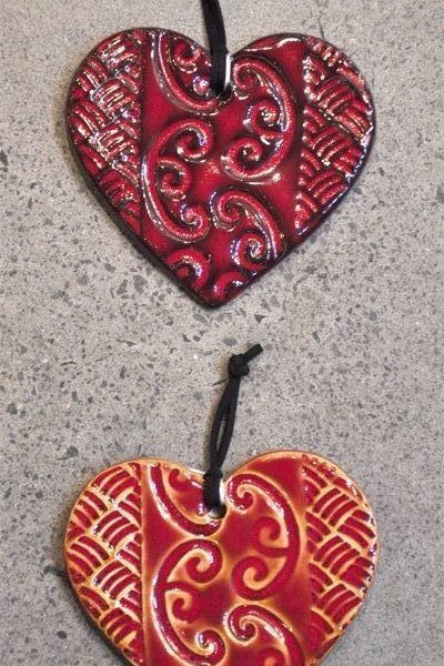 Small patterned red ceramic hearts by Michelle Bow